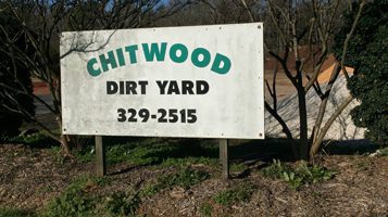 Chitwood Dirt Yard | Rock Hill, SC | Chitwood Dirtyard sign in front of trees