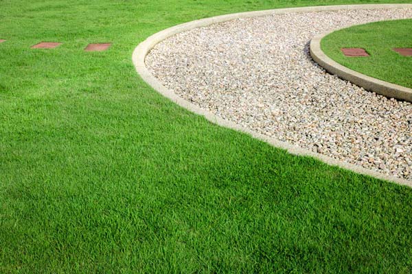 Chitwood Dirt Yard | Rock Hill, SC | well manicured lawn with a stone path